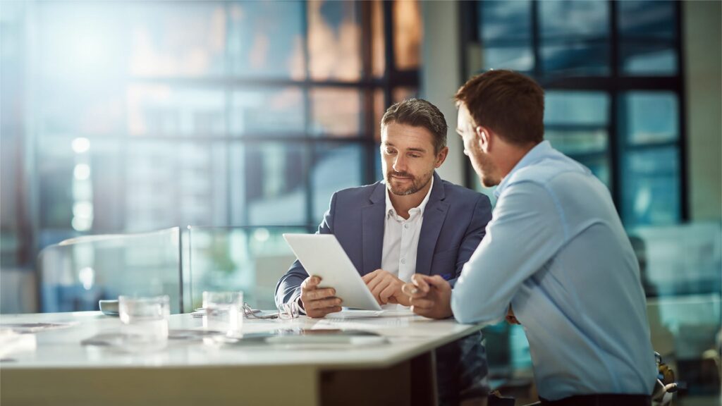 Two businessmen discussing a proposal